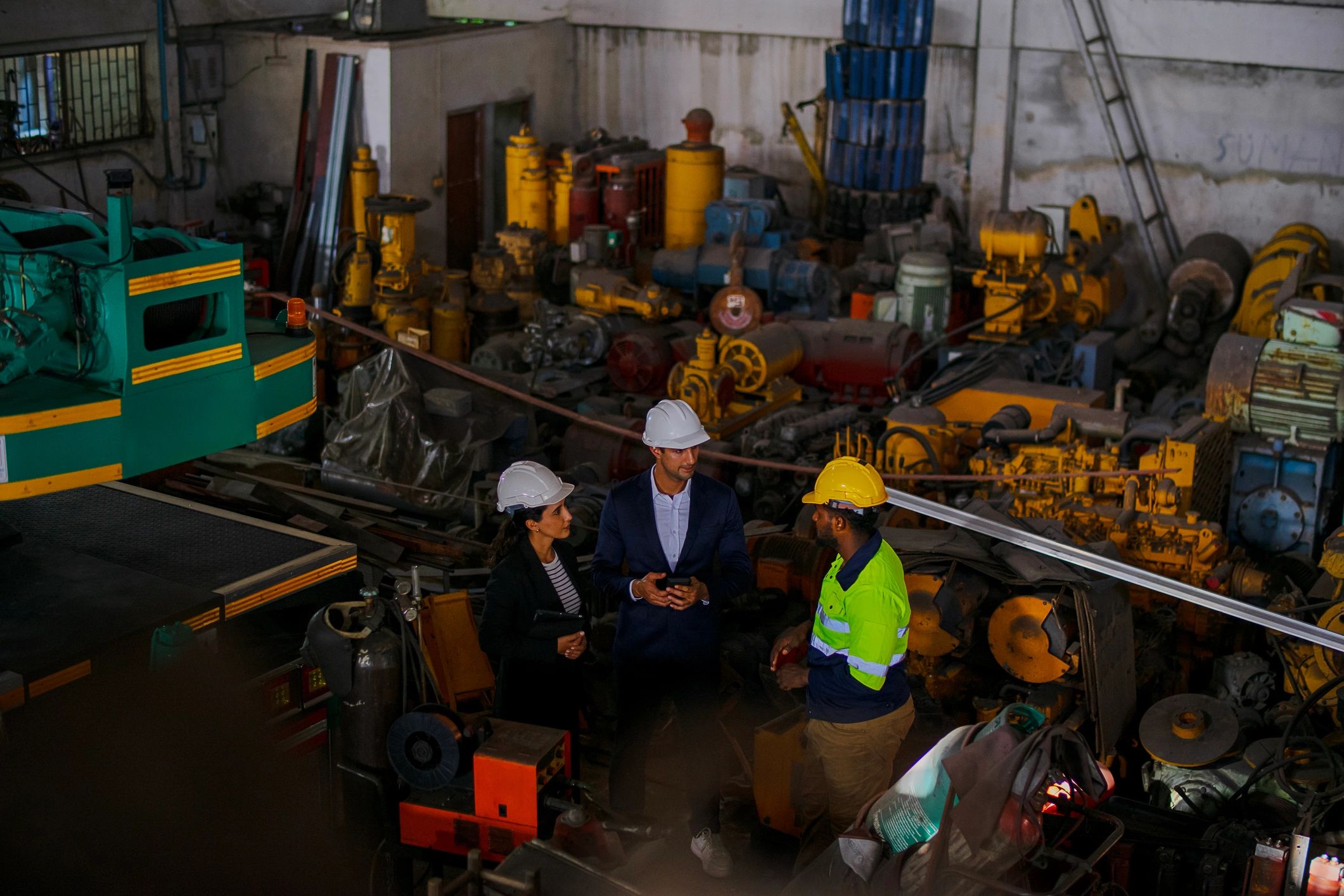 Engineer and business client meeting on an industrial site